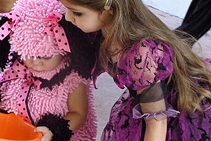 Two Girls Looking at the Candy